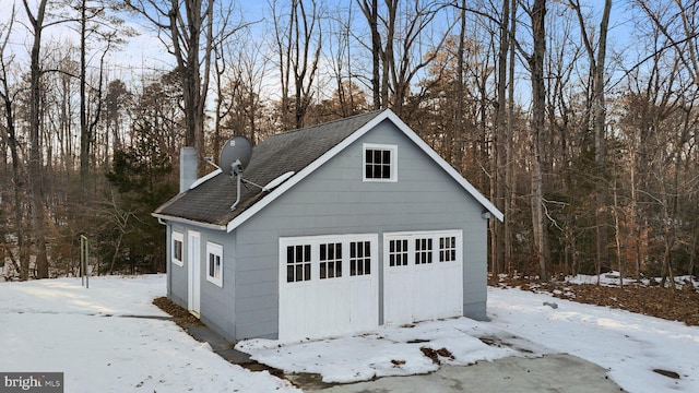 view of snow covered garage