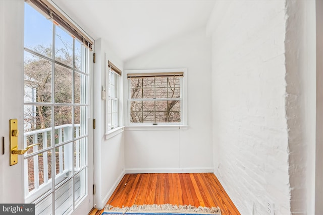 unfurnished sunroom with lofted ceiling and a healthy amount of sunlight