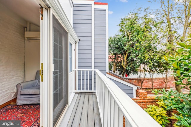 balcony featuring an AC wall unit