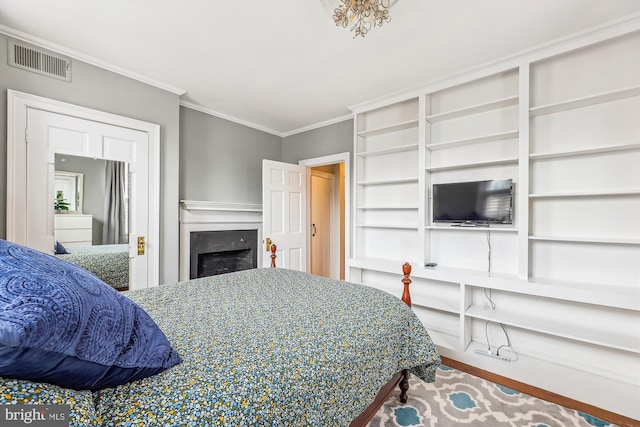 bedroom featuring crown molding