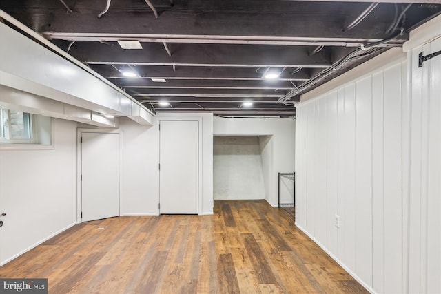 basement featuring dark wood-type flooring