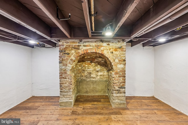 basement with hardwood / wood-style floors