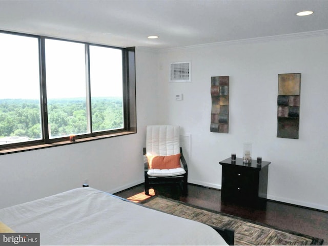 bedroom with dark wood-type flooring and crown molding