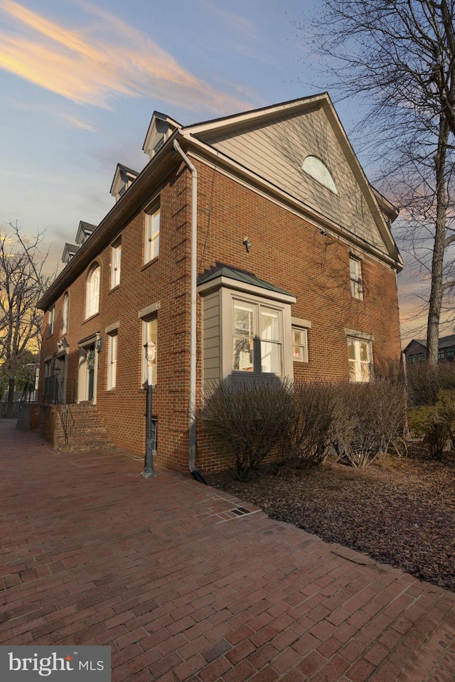 view of property exterior at dusk