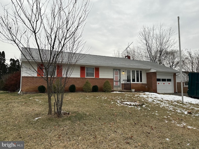 single story home with a garage and a front lawn