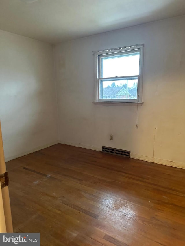 unfurnished room featuring wood-type flooring