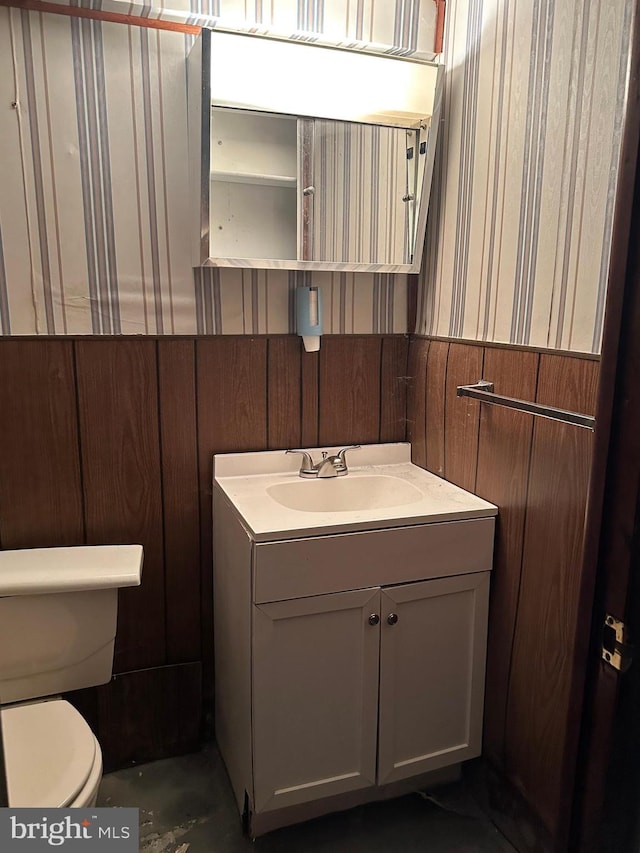 bathroom featuring vanity and toilet