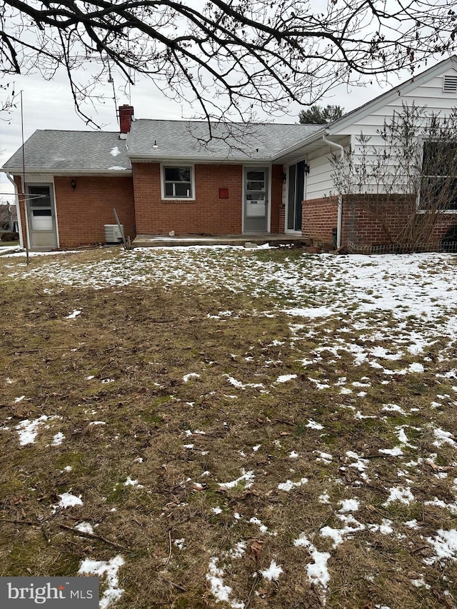 view of snow covered house