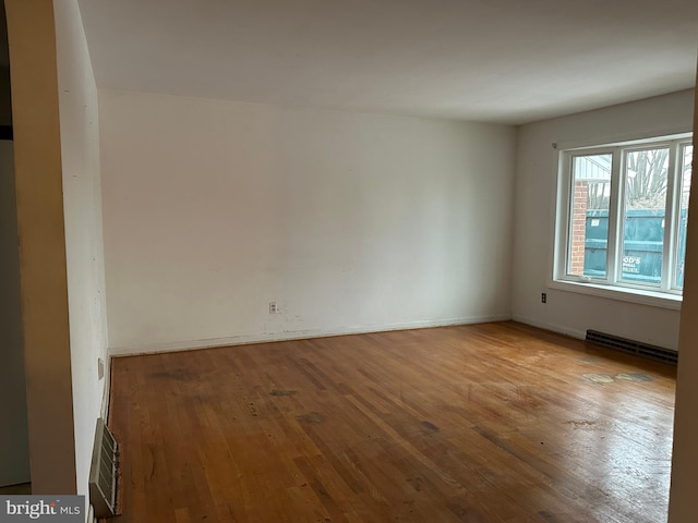 empty room with light hardwood / wood-style flooring