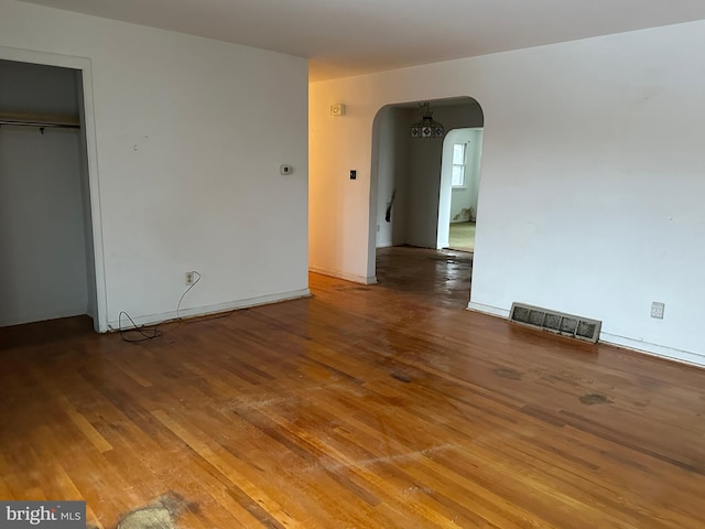 spare room with wood-type flooring