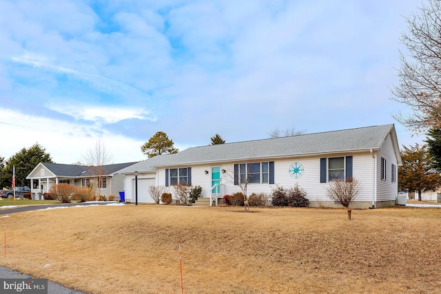 single story home with a garage and a front yard