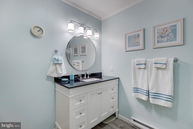 bathroom featuring crown molding, vanity, hardwood / wood-style flooring, and a baseboard heating unit