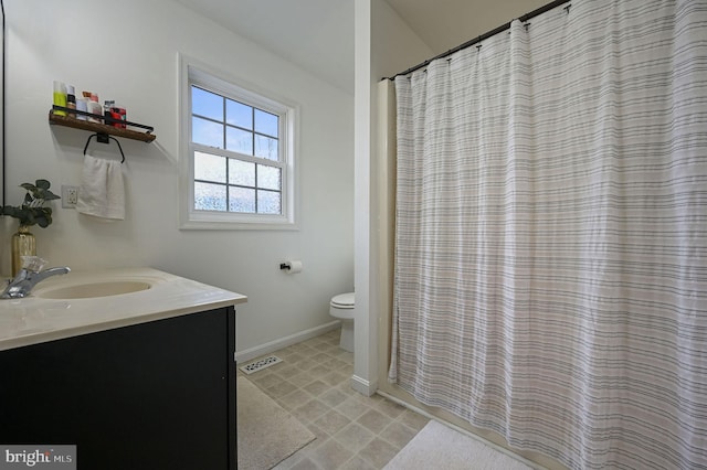 bathroom with vanity and toilet