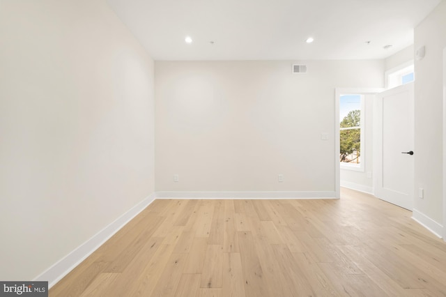 spare room with light hardwood / wood-style flooring