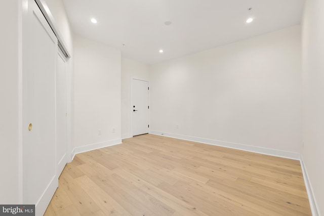 unfurnished room with light wood-type flooring