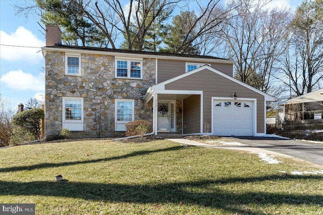 front facade with a front yard and a garage