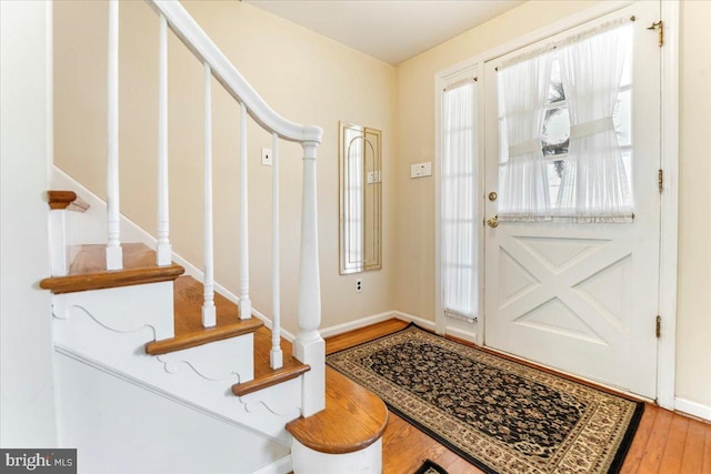 entryway with hardwood / wood-style floors