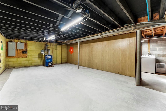 basement featuring electric panel and washer / clothes dryer