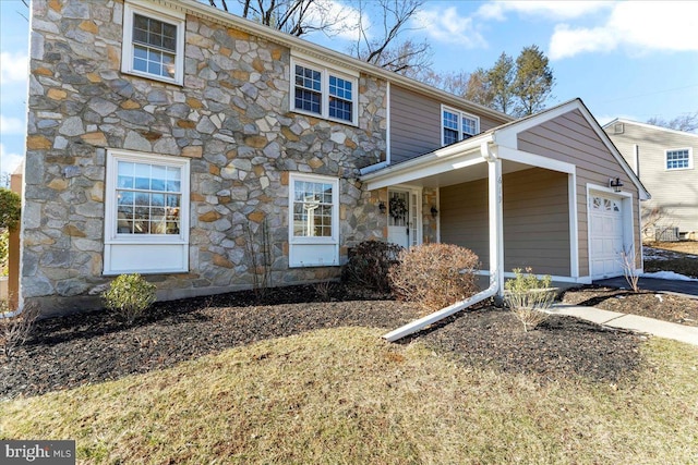 view of front of property with a garage