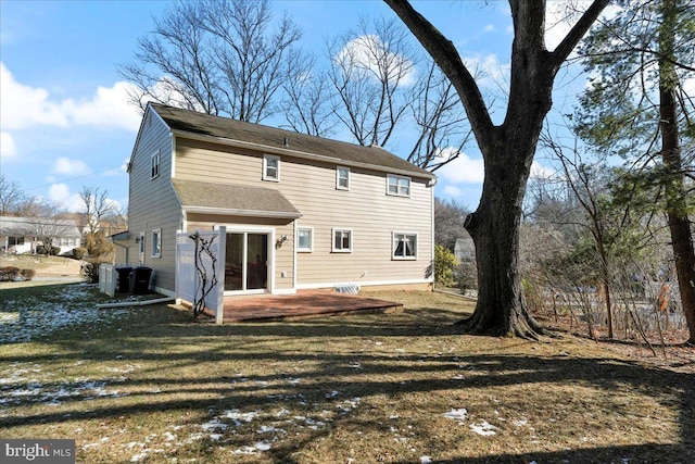 rear view of house with a patio area and a lawn