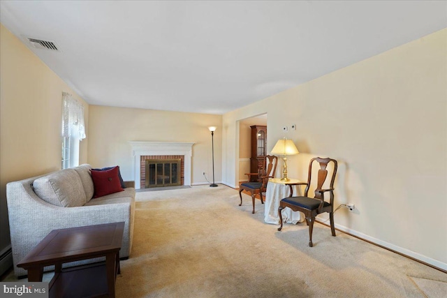 living room with a fireplace and light carpet