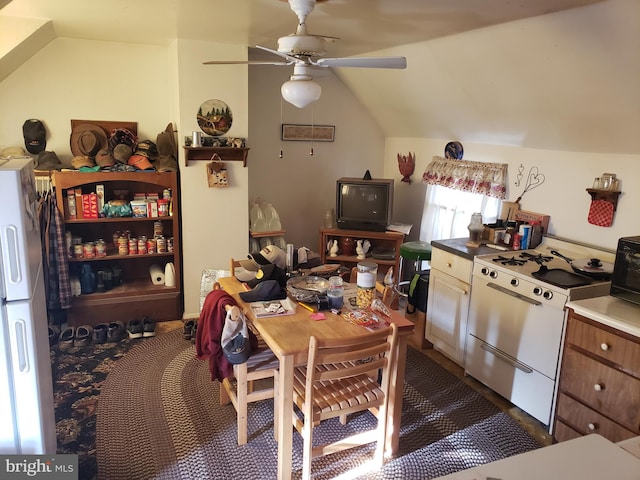 kitchen with ceiling fan, white refrigerator, dishwasher, and lofted ceiling