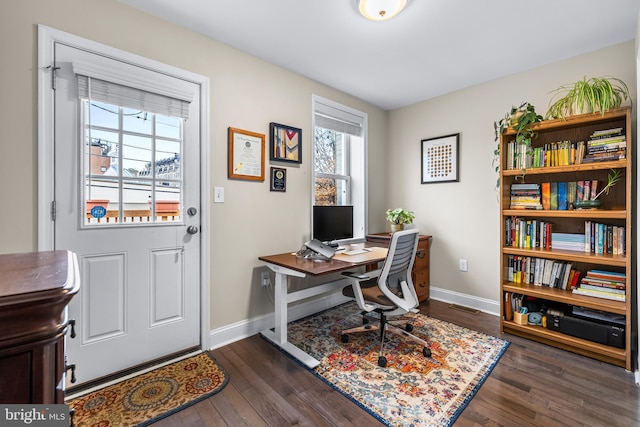 home office featuring dark hardwood / wood-style flooring