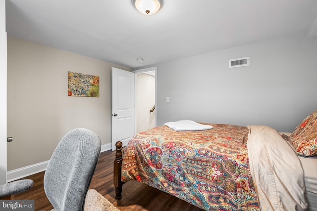 bedroom featuring dark hardwood / wood-style floors