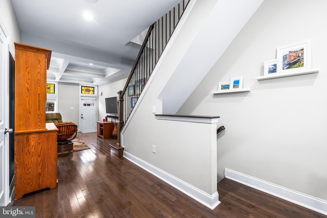 stairs with hardwood / wood-style flooring, beam ceiling, and coffered ceiling