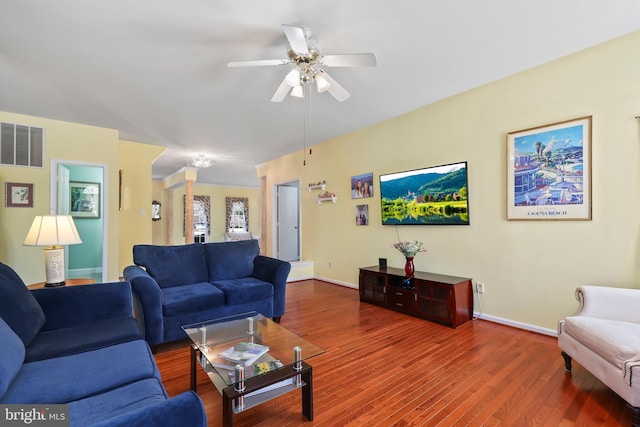 living room with ceiling fan and hardwood / wood-style flooring