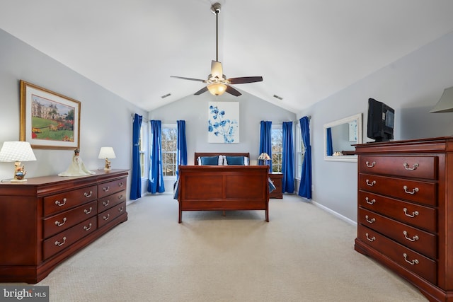 carpeted bedroom with vaulted ceiling and ceiling fan