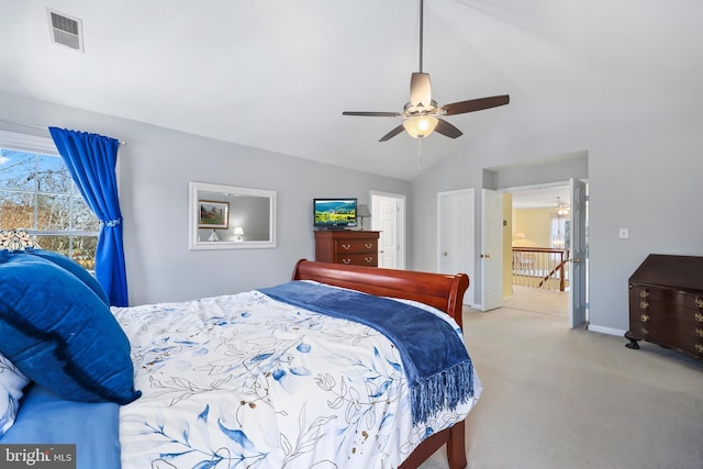 carpeted bedroom featuring ceiling fan and lofted ceiling