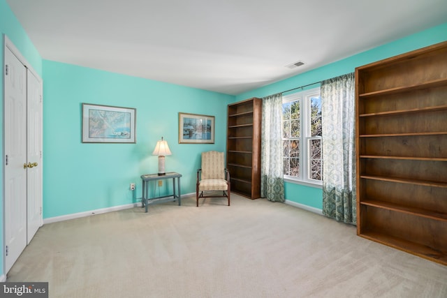 sitting room with light carpet