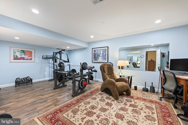 workout room featuring hardwood / wood-style flooring