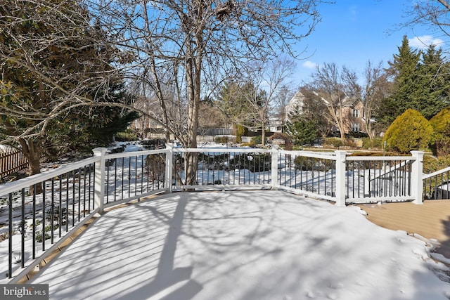 view of snow covered deck