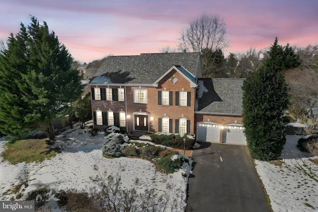 colonial house featuring a garage