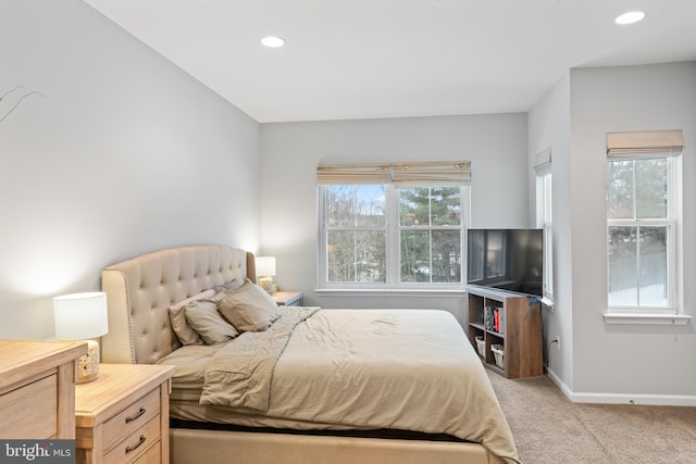 bedroom featuring recessed lighting, baseboards, and light carpet