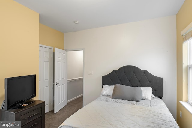 bedroom with dark carpet