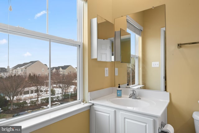 bathroom with vanity and toilet