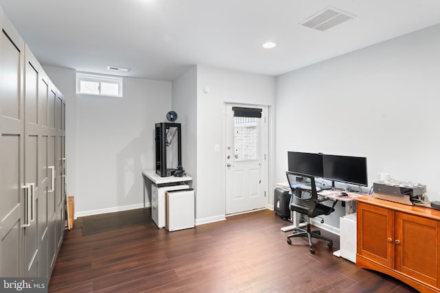 home office with recessed lighting, visible vents, baseboards, and dark wood-type flooring