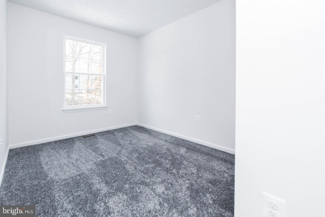 unfurnished room featuring carpet flooring