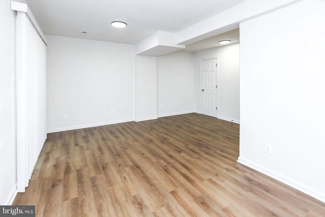 empty room featuring wood-type flooring