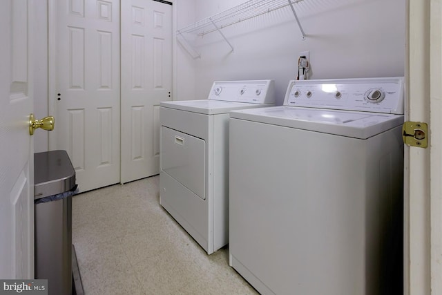 clothes washing area featuring washing machine and clothes dryer