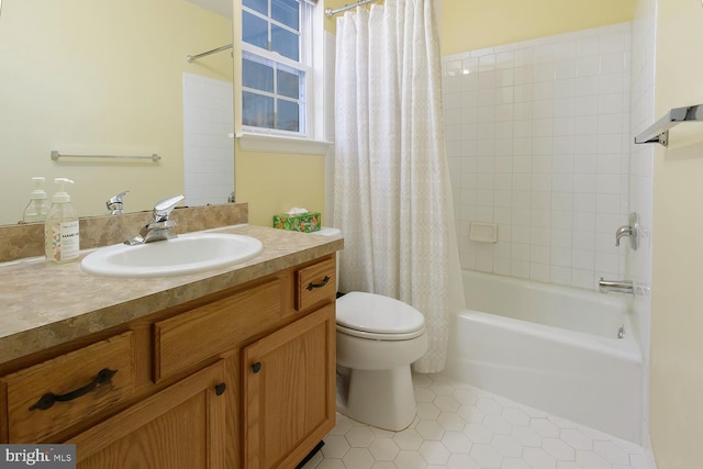 full bathroom featuring toilet, vanity, tile patterned floors, and shower / bath combination with curtain