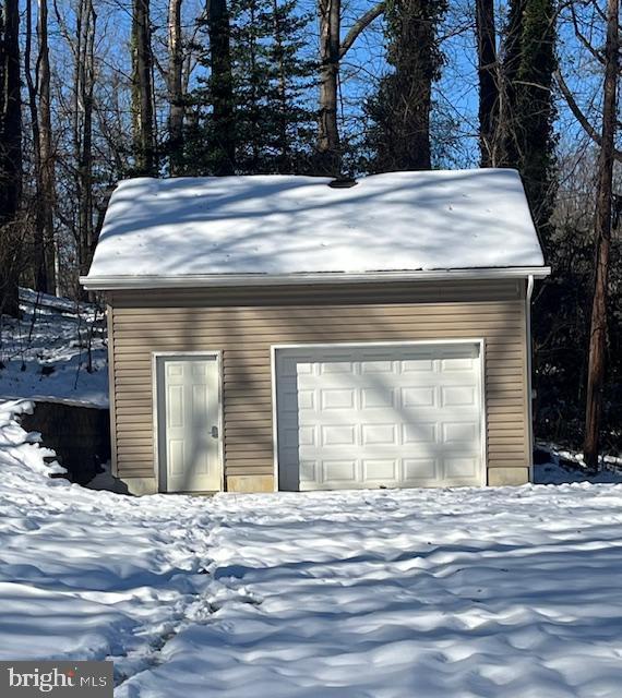 view of snow covered garage