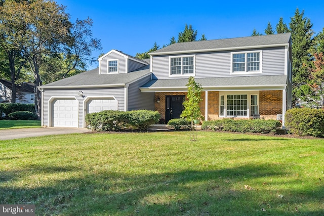 front facade featuring a front lawn and a garage