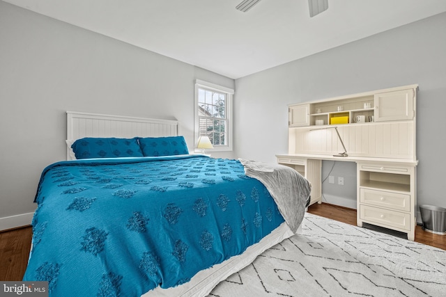 bedroom featuring ceiling fan and dark hardwood / wood-style floors