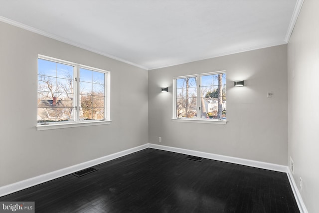 empty room featuring crown molding and hardwood / wood-style floors