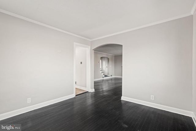 spare room with dark hardwood / wood-style floors and ornamental molding