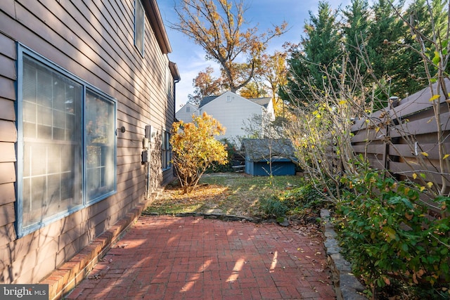 view of patio / terrace with a storage shed